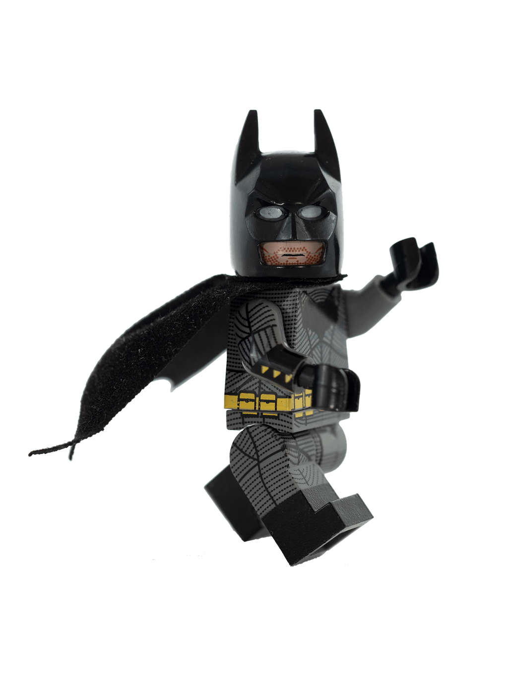 Lego figure of a black-suited superhero with a cape and mask in a dynamic pose