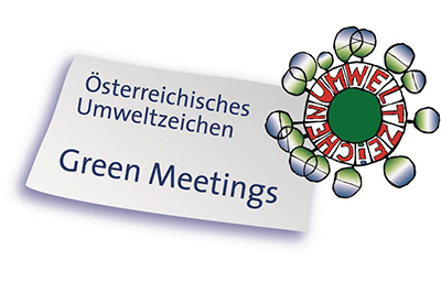 A label with the text "Österreichisches Umweltzeichen Green Meetings" and a circular logo with the word "UMWELTZEICHEN" around a green center.