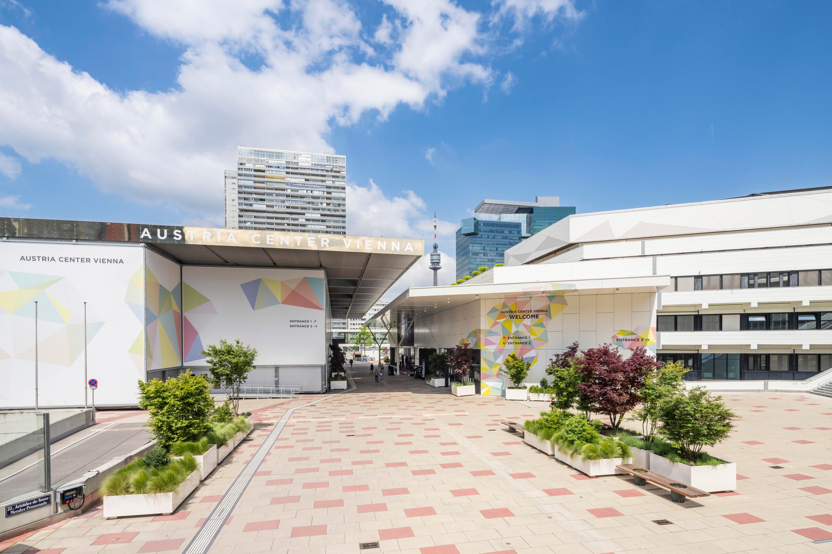 Austria Center Vienna entrance with colorful geometric patterns and plants